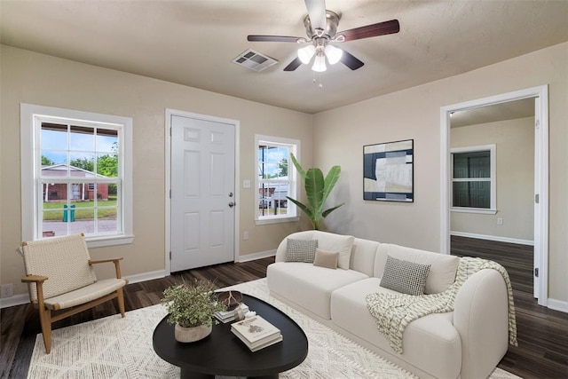 436 SE 54th St, Oklahoma City, OK 73129 - living room featuring baseboards, dark wood finished floors, and a ceiling fan