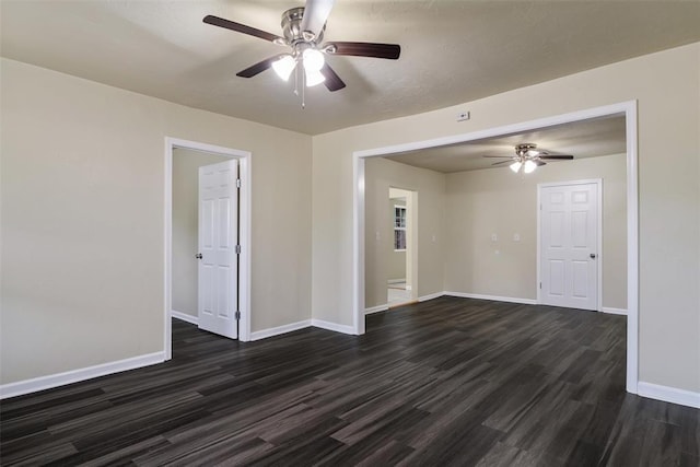 436 SE 54th St, Oklahoma City, OK 73129 - spare room featuring a ceiling fan, dark wood-style flooring, and baseboards