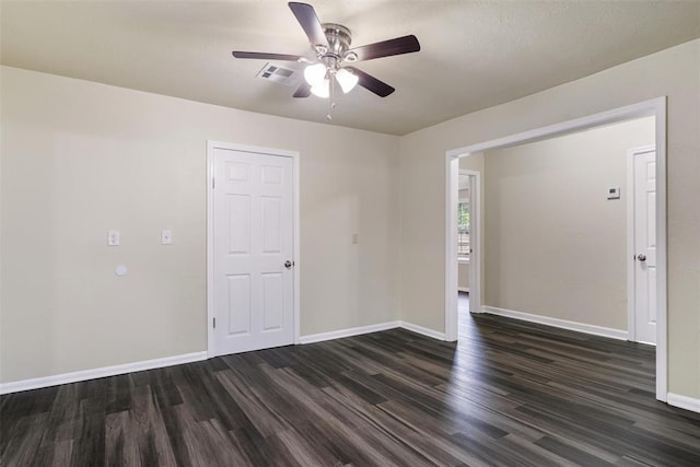 436 SE 54th St, Oklahoma City, OK 73129 - empty room featuring dark wood finished floors, a ceiling fan, and baseboards