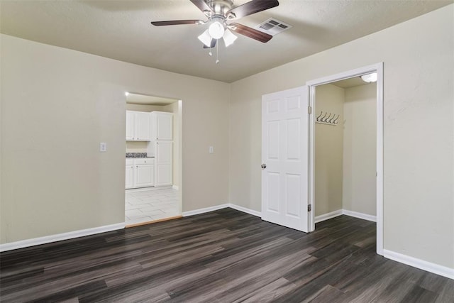 436 SE 54th St, Oklahoma City, OK 73129 - unfurnished bedroom featuring dark wood finished floors, baseboards, and ceiling fan