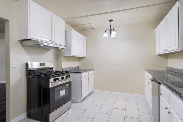 436 SE 54th St, Oklahoma City, OK 73129 - kitchen with appliances with stainless steel finishes, under cabinet range hood, baseboards, white cabinets, and dark stone counters