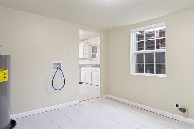 436 SE 54th St, Oklahoma City, OK 73129 - spare room featuring water heater, baseboards, and light tile patterned flooring