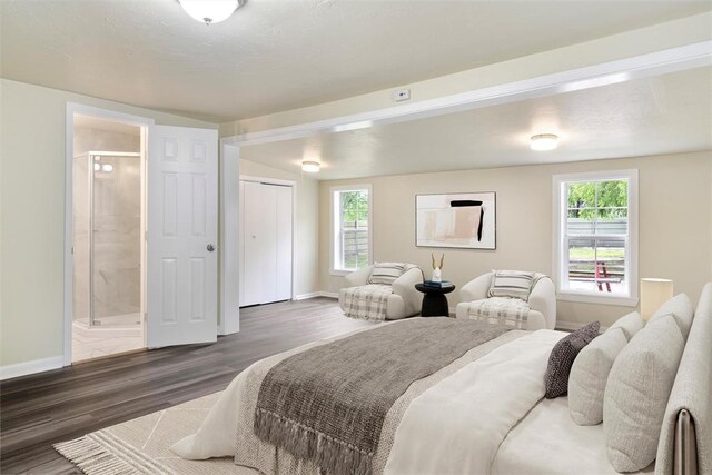 436 SE 54th St, Oklahoma City, OK 73129 - bedroom with baseboards, wood finished floors, and ensuite bathroom