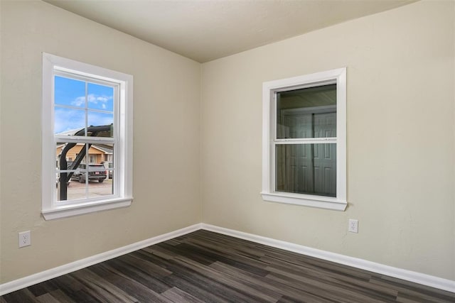 436 SE 54th St, Oklahoma City, OK 73129 - unfurnished room featuring baseboards and dark wood-type flooring