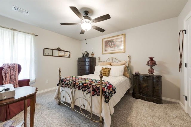 8208 Poplar Dr, Edmond, OK 73034 - carpeted bedroom with baseboards and ceiling fan
