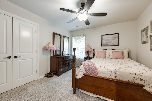 8208 Poplar Dr, Edmond, OK 73034 - bedroom featuring light colored carpet, baseboards, a ceiling fan, and a closet