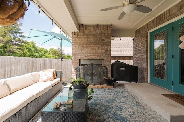 8208 Poplar Dr, Edmond, OK 73034 - view of patio with an outdoor living space with a fireplace and ceiling fan