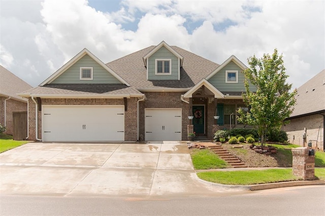 8208 Poplar Dr, Edmond, OK 73034 - view of front facade featuring brick siding, concrete driveway, and a shingled roof