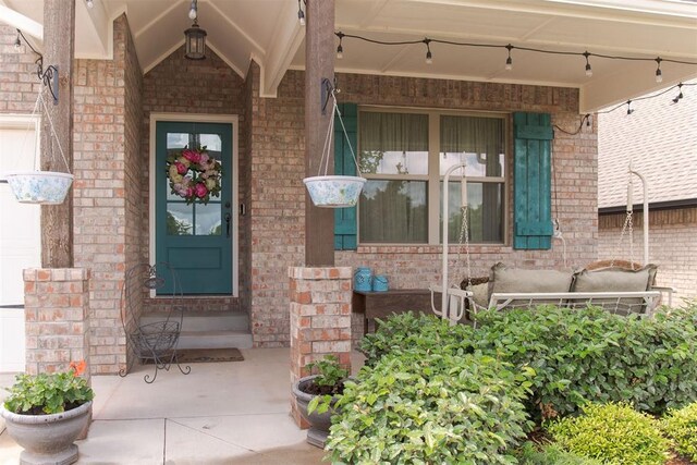 8208 Poplar Dr, Edmond, OK 73034 - entrance to property with brick siding and covered porch