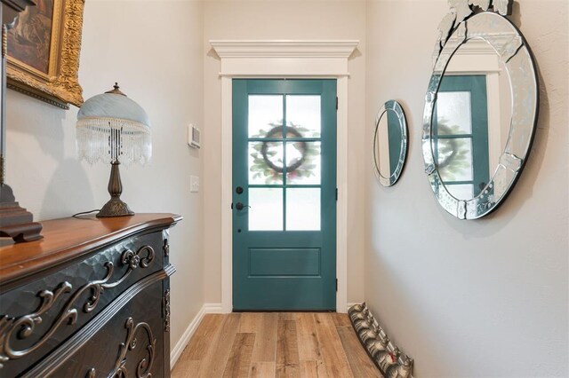 8208 Poplar Dr, Edmond, OK 73034 - foyer entrance with light wood-type flooring, plenty of natural light, and baseboards