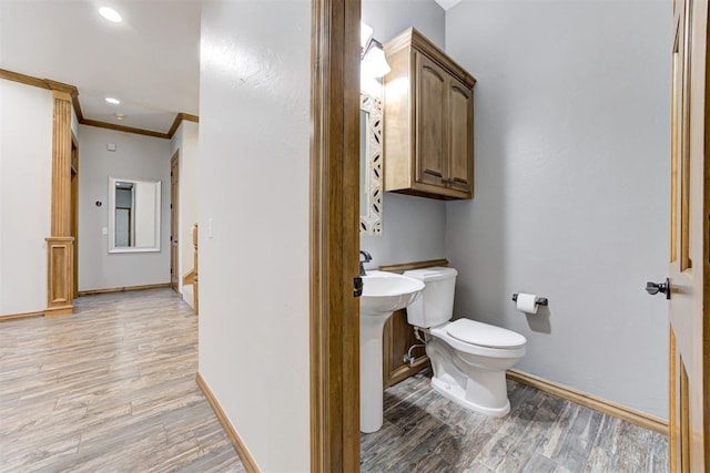 3401 Fox Hill Ter, Edmond, OK 73034 - bathroom featuring wood finished floors and ornamental molding