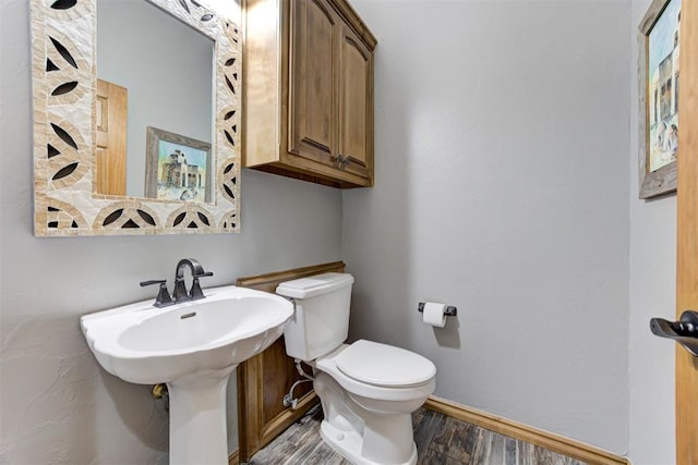 3401 Fox Hill Ter, Edmond, OK 73034 - bathroom featuring wood finished floors and toilet
