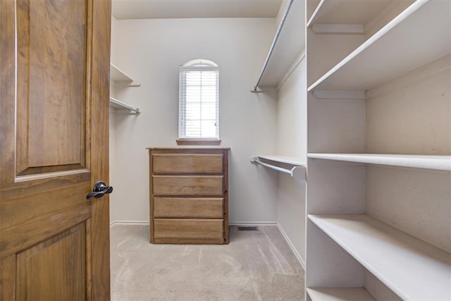 3401 Fox Hill Ter, Edmond, OK 73034 - walk in closet featuring light carpet