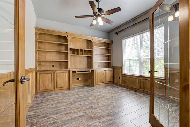 3401 Fox Hill Ter, Edmond, OK 73034 - unfurnished office with french doors, wainscoting, a ceiling fan, and light wood-style flooring