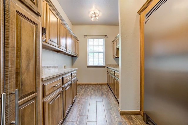 3401 Fox Hill Ter, Edmond, OK 73034 - kitchen with built in refrigerator and wood finished floors