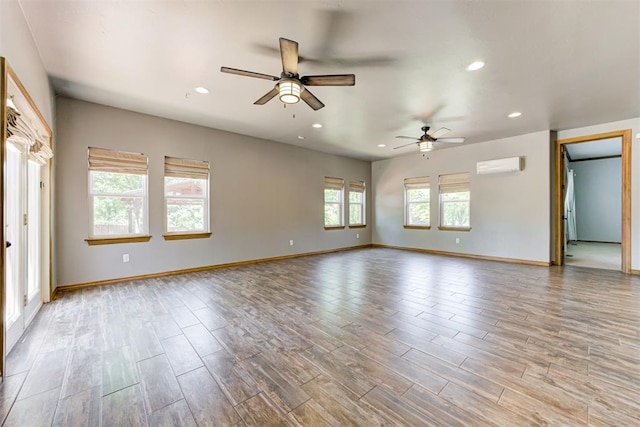 3401 Fox Hill Ter, Edmond, OK 73034 - unfurnished room with a wall mounted air conditioner, a ceiling fan, wood finished floors, and recessed lighting