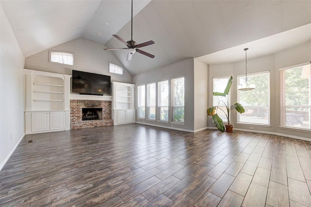 3401 Fox Hill Ter, Edmond, OK 73034 - unfurnished living room with healthy amount of natural light, high vaulted ceiling, wood finished floors, a ceiling fan, and a fireplace