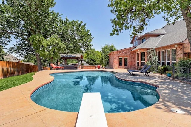 3401 Fox Hill Ter, Edmond, OK 73034 - view of pool with a fenced backyard, a patio area, and a diving board