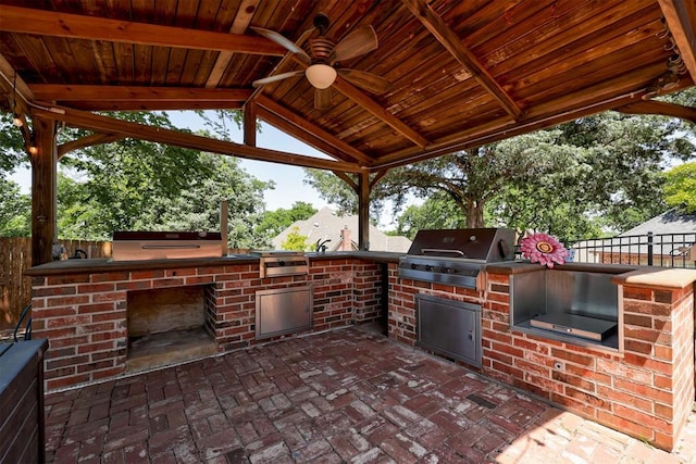 3401 Fox Hill Ter, Edmond, OK 73034 - view of patio / terrace featuring an outdoor kitchen, a ceiling fan, and a gazebo