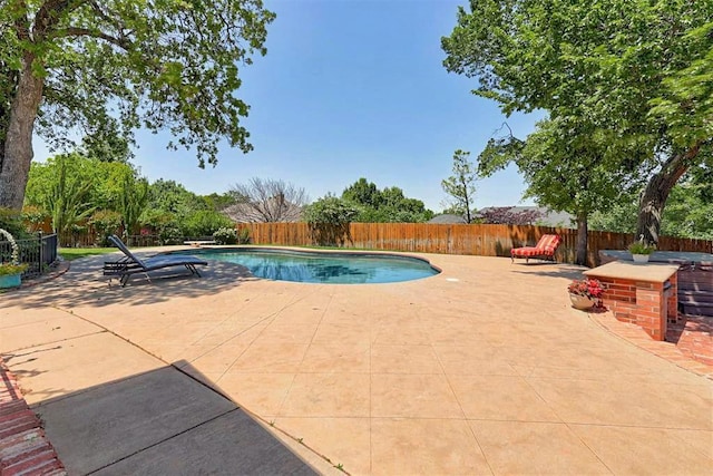 3401 Fox Hill Ter, Edmond, OK 73034 - view of swimming pool with a patio area and a fenced backyard