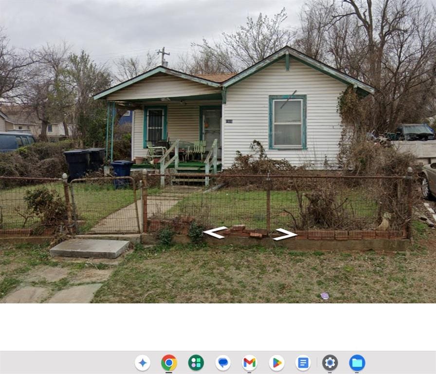1610 NE 15th St, Oklahoma City, OK 73117 - view of front of house with covered porch and a gate