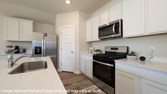 2504 Kathleens Xing, Yukon, OK 73099 - kitchen with appliances with stainless steel finishes, a sink, light countertops, white cabinetry, and recessed lighting