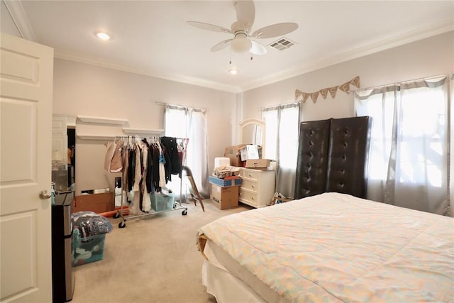 carpeted bedroom with crown molding, recessed lighting, and a ceiling fan
