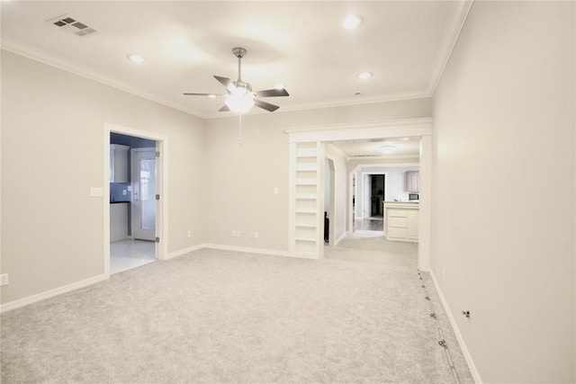empty room with a ceiling fan, recessed lighting, ornamental molding, baseboards, and light carpet