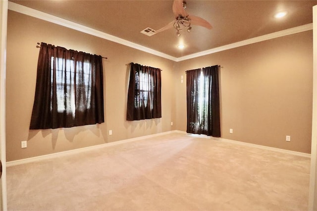 empty room featuring a ceiling fan, carpet flooring, ornamental molding, baseboards, and recessed lighting
