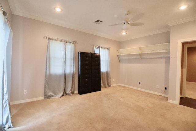 unfurnished bedroom with ornamental molding, carpet, baseboards, recessed lighting, and ceiling fan