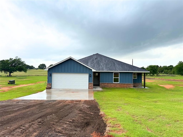 2476 County St Unit 2960, Blanchard, OK 73010 - view of front of home featuring board and batten siding, driveway, a garage, and a front lawn