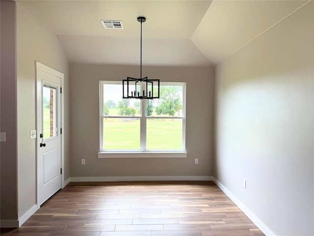 2476 County St Unit 2960, Blanchard, OK 73010 - unfurnished dining area featuring vaulted ceiling, a chandelier, light wood-style floors, and baseboards