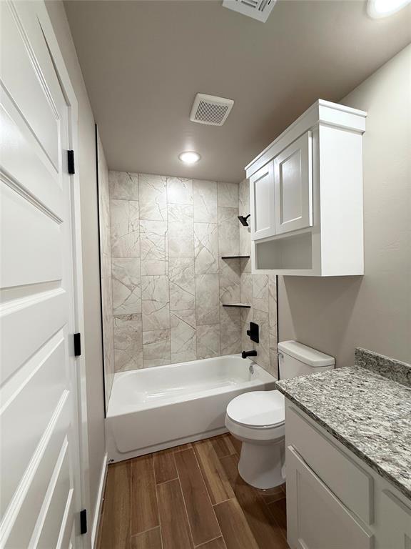 2476 County St Unit 2960, Blanchard, OK 73010 - bathroom with vanity, wood tiled floors, recessed lighting, toilet, and shower / bath combination