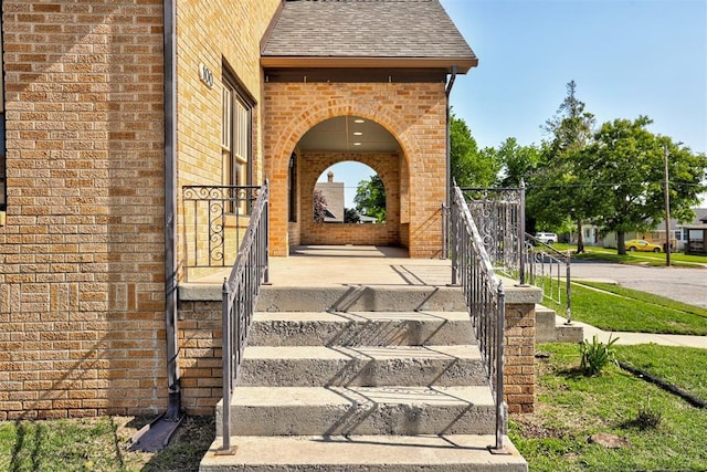100 S Macomb Ave, El Reno, OK 73036 - property entrance with brick siding and a shingled roof