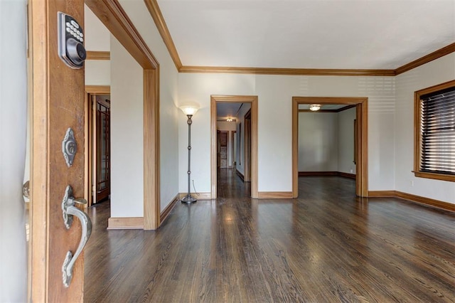 100 S Macomb Ave, El Reno, OK 73036 - unfurnished room featuring dark wood-style floors, baseboards, and crown molding