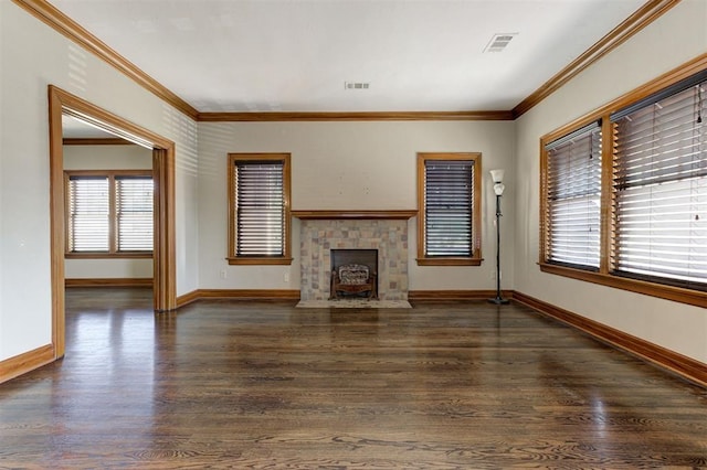 100 S Macomb Ave, El Reno, OK 73036 - unfurnished living room with ornamental molding, wood finished floors, and baseboards