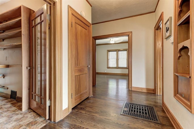 100 S Macomb Ave, El Reno, OK 73036 - corridor with crown molding, baseboards, and wood finished floors