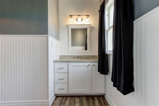 100 S Macomb Ave, El Reno, OK 73036 - bathroom featuring wood finished floors and vanity