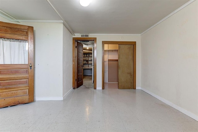 100 S Macomb Ave, El Reno, OK 73036 - empty room with crown molding, tile patterned floors, and baseboards