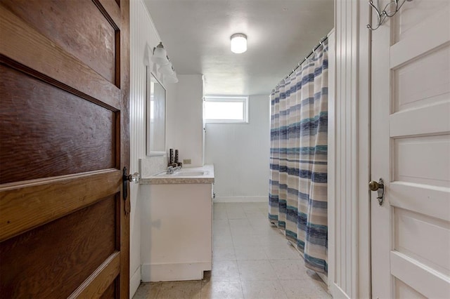 100 S Macomb Ave, El Reno, OK 73036 - full bath with vanity, baseboards, and a shower with shower curtain
