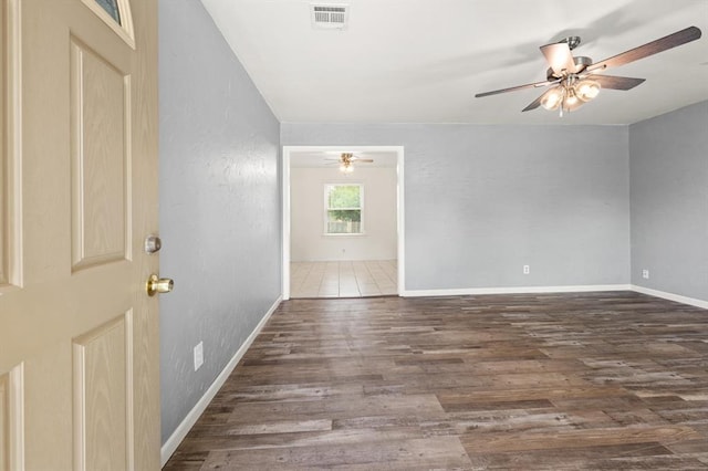 2545 W Eubanks St, Oklahoma City, OK 73112 - unfurnished room featuring a ceiling fan, wood finished floors, and baseboards