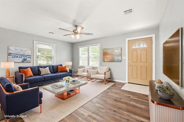 2545 W Eubanks St, Oklahoma City, OK 73112 - living area featuring wood finished floors, ceiling fan, and baseboards