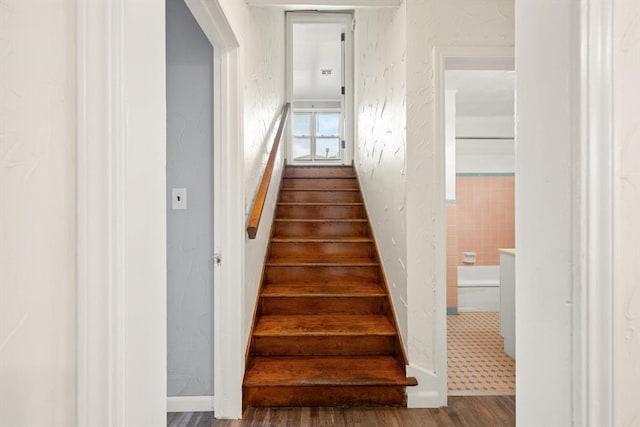 2545 W Eubanks St, Oklahoma City, OK 73112 - staircase with a textured wall and wood finished floors