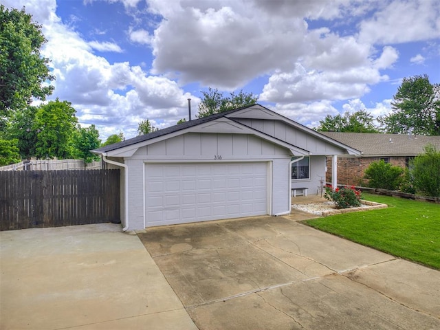 view of front of home with board and batten siding, driveway, a garage, and brick siding