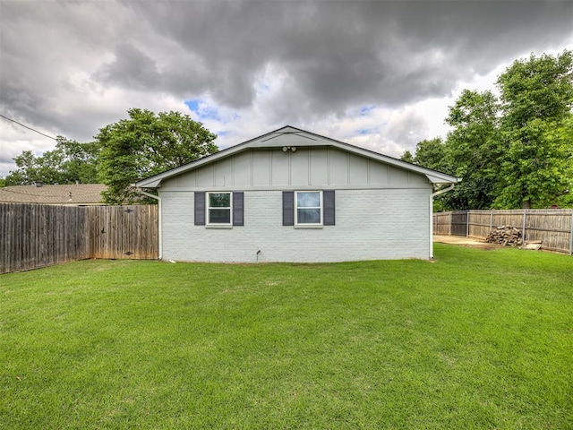rear view of property with board and batten siding