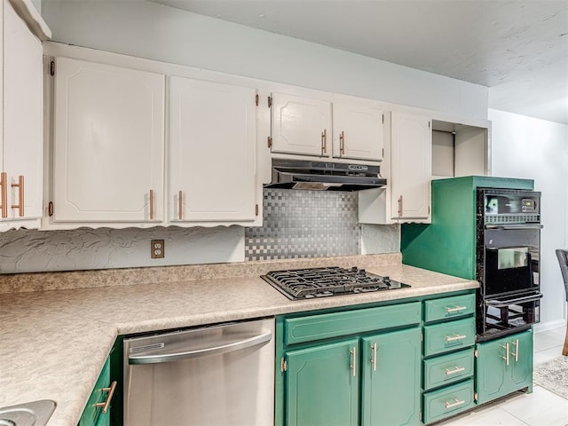 kitchen featuring appliances with stainless steel finishes, under cabinet range hood, light countertops, and white cabinets