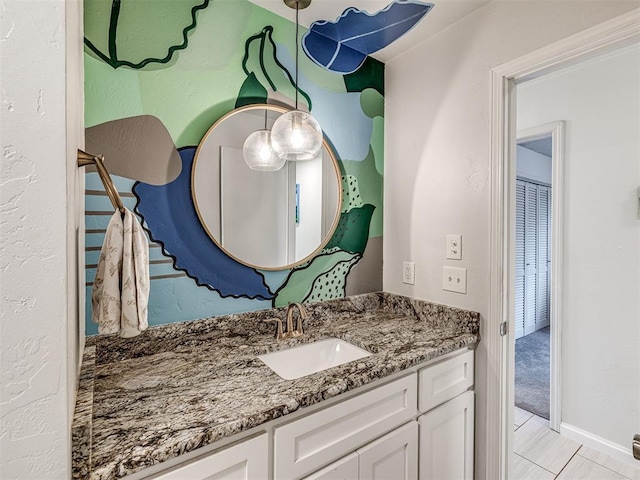 bathroom with tile patterned flooring and vanity