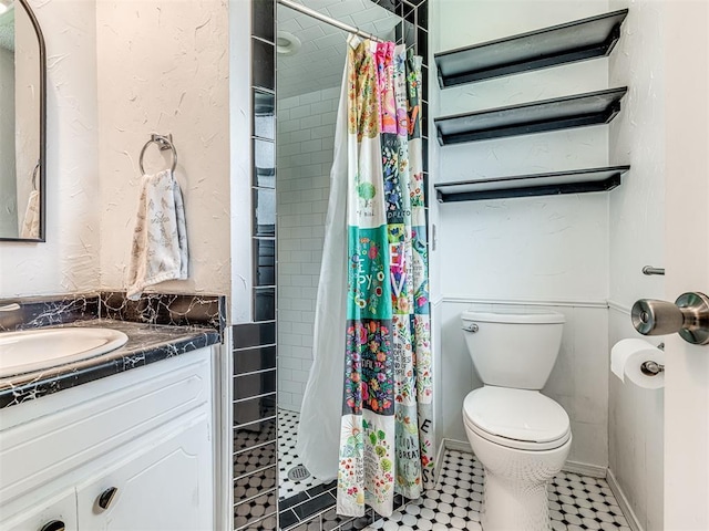full bath with toilet, a stall shower, and vanity