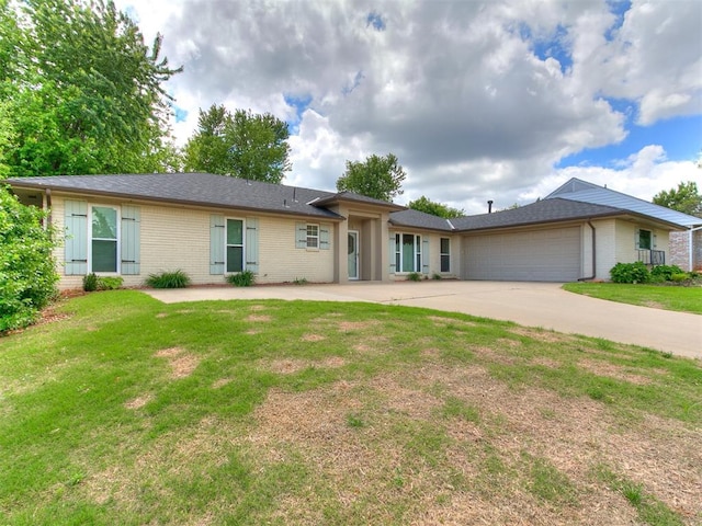 2916 Prairie Rose Ct, Oklahoma City, OK 73120 - ranch-style home featuring brick siding, an attached garage, concrete driveway, and a front yard