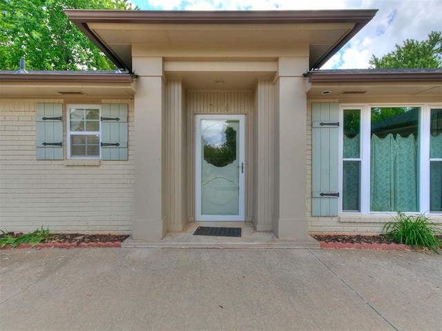 2916 Prairie Rose Ct, Oklahoma City, OK 73120 - doorway to property featuring brick siding